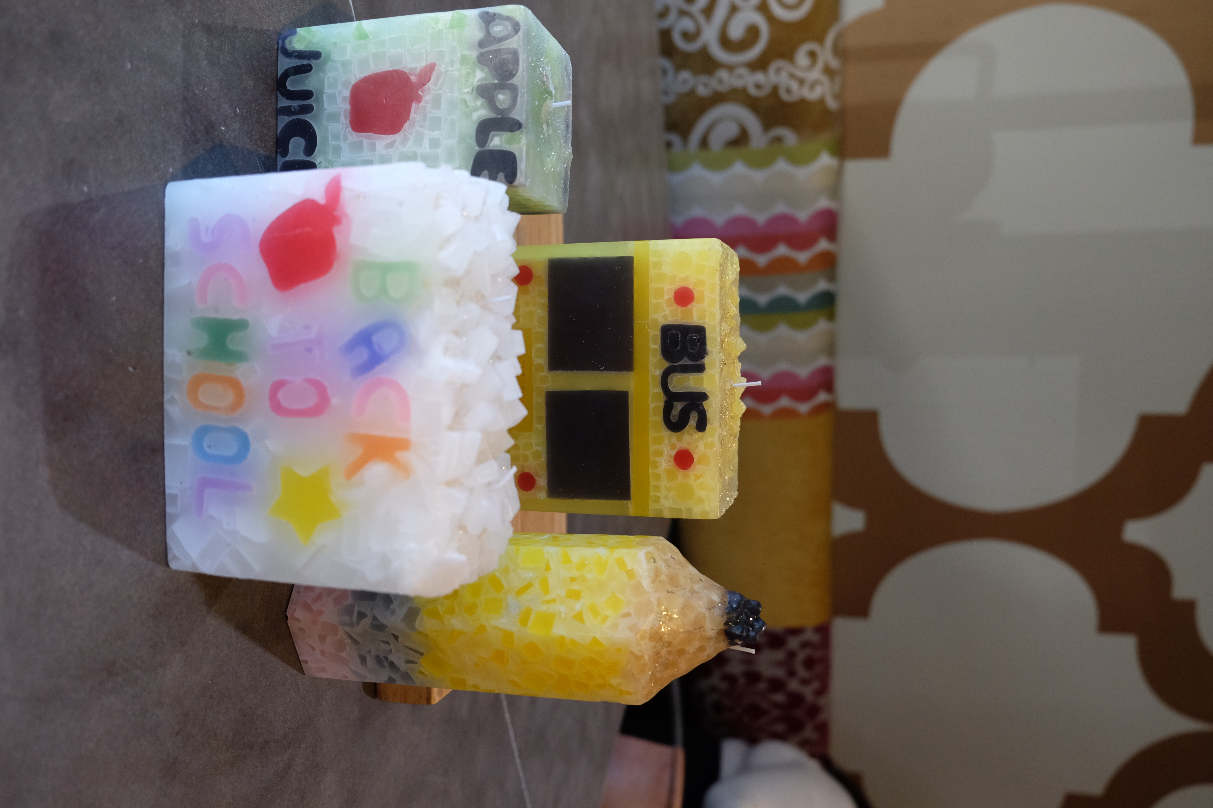 Back to school themed candles including school bus and apple juice candles