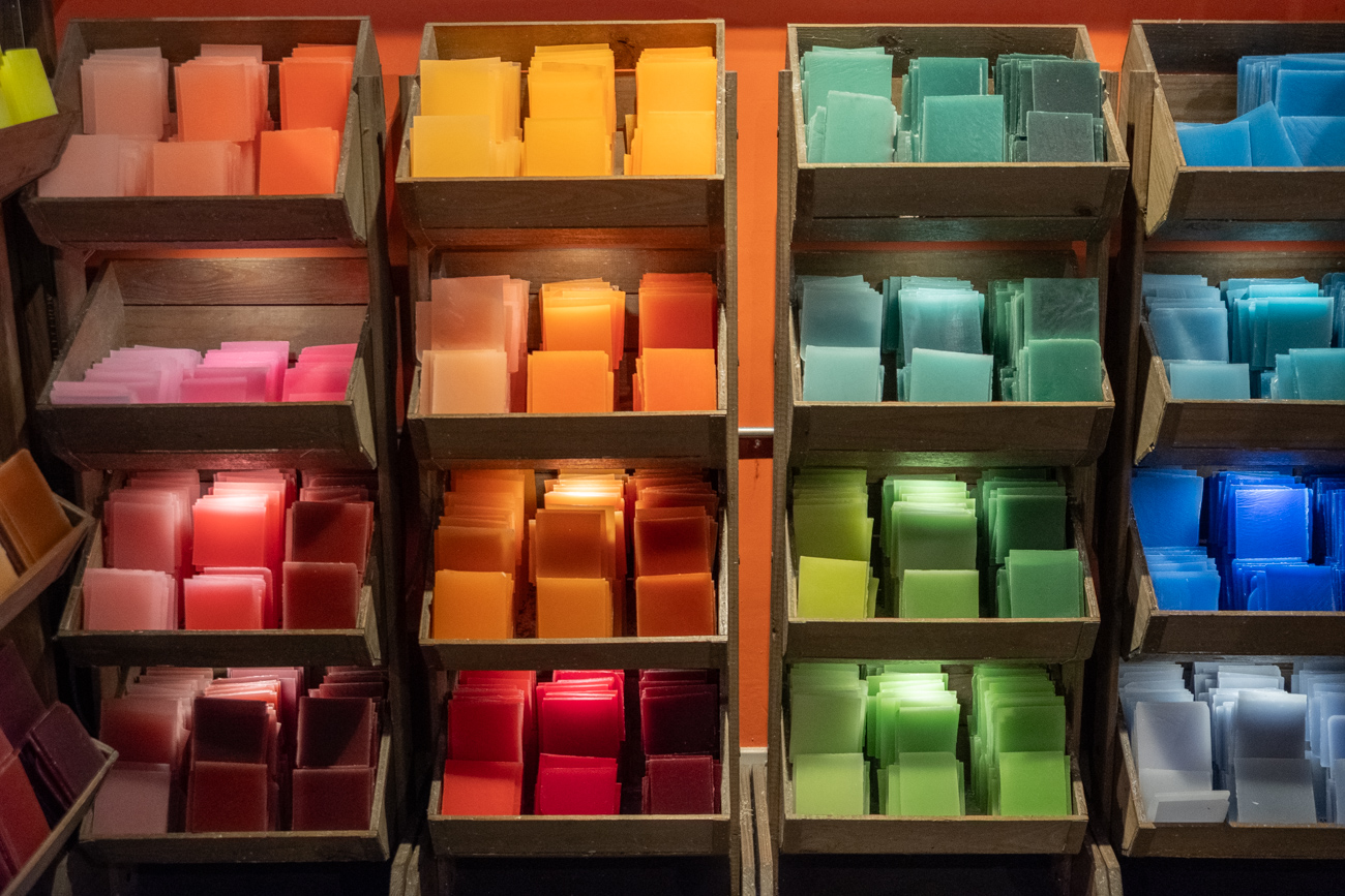 Colorful wax tile wall display at Glow Candle Lounge