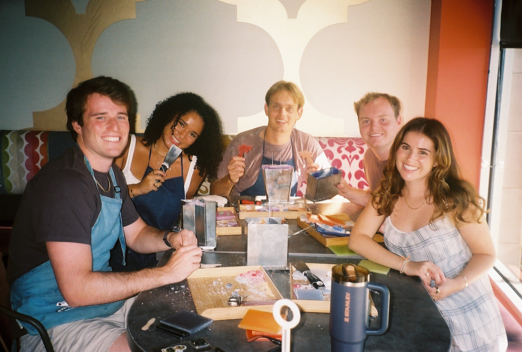 A group enjoying candle making together at Glow Candle Lounge