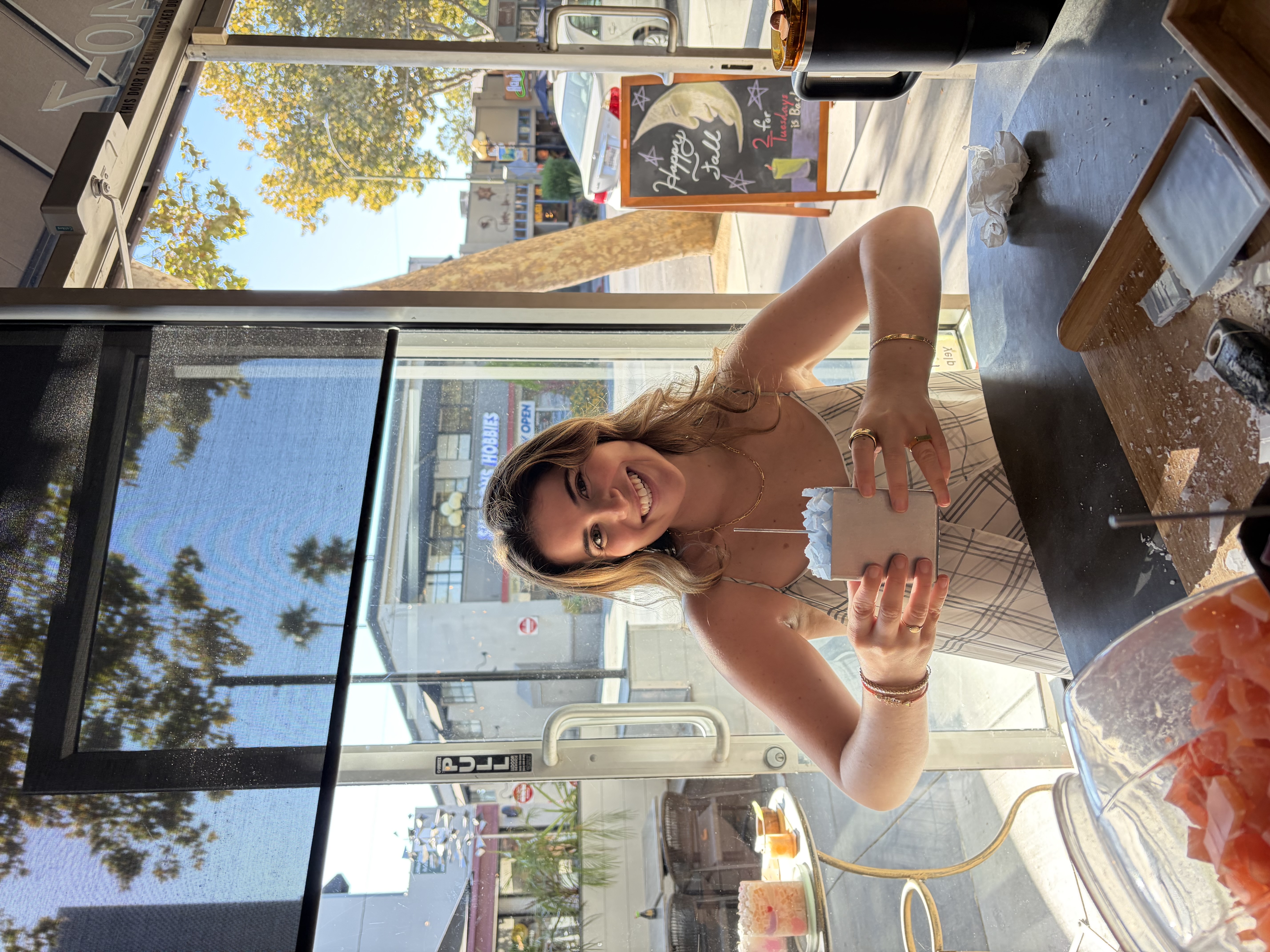 Guest holding a candle she made at Glow Candle Lounge